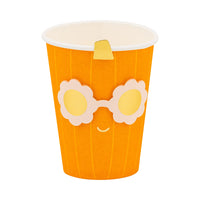 Orange paper cup with a cartoon face design on a white background