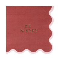 Close-up of the single maroon paper cocktail napkin featuring the gold foil "Be Merry" text.