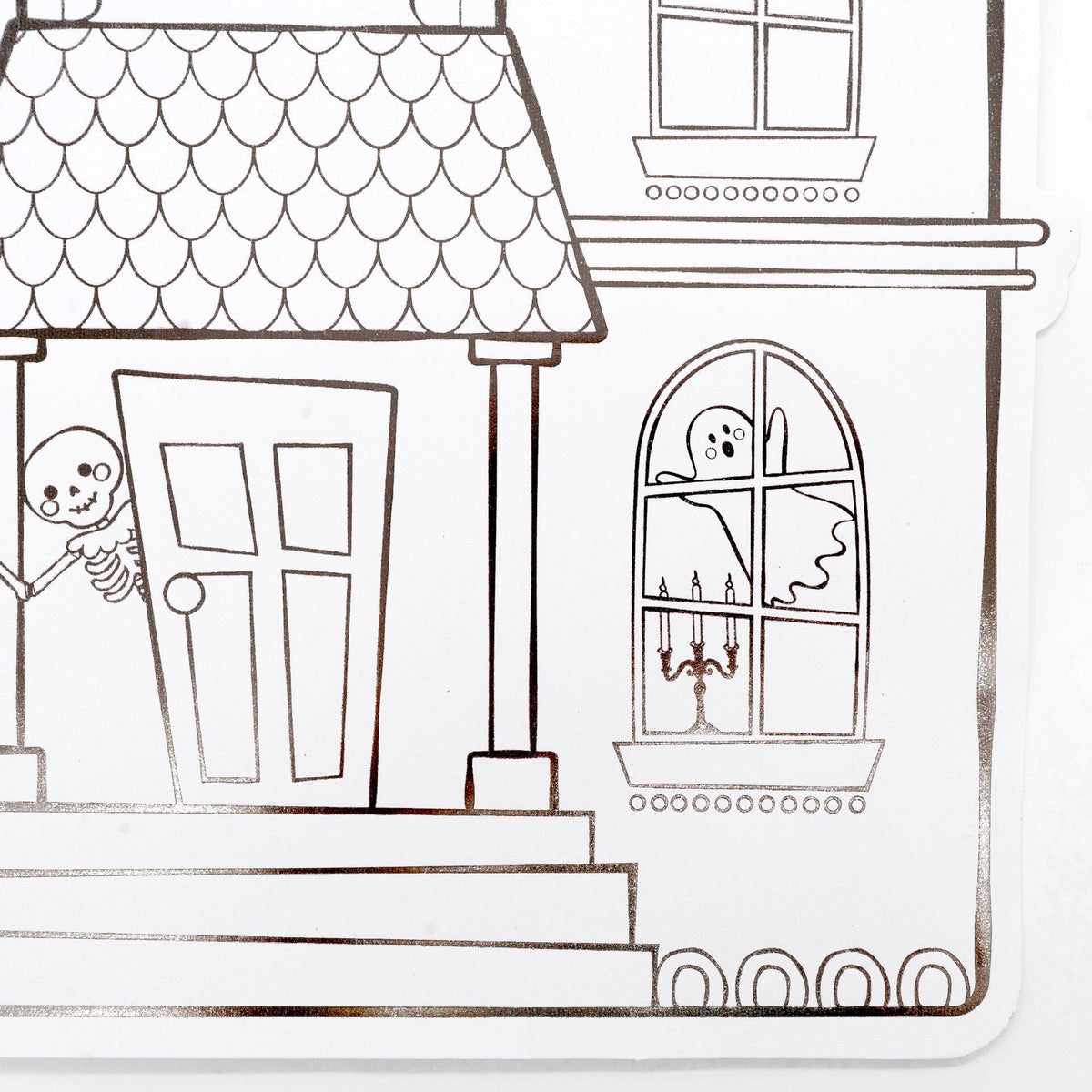 Close up detail of the paper placemat showing a line-art skeleton standing by the haunted house front door and a ghost in the window.