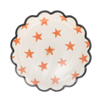 Decorative paper plate with star pattern on a clear packaging.