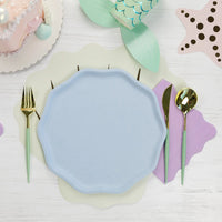 Sky blue compostable dinner plate with gold flatware and mermaid accents.