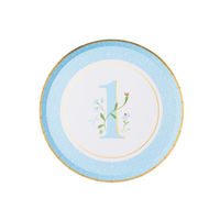 Single round sky blue first birthday paper plate with illustrated floral number 1, ladybug detail and gold foil border on white background