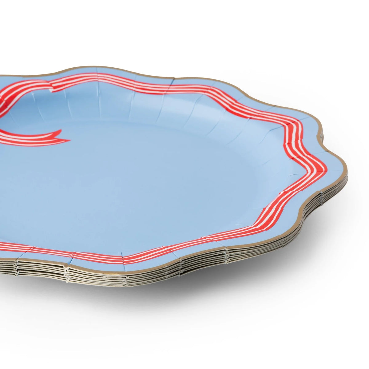 Stack of sky blue paper dinner plates with a red-and-white striped bow motif, striped ribbon border, and wavy gold edge.