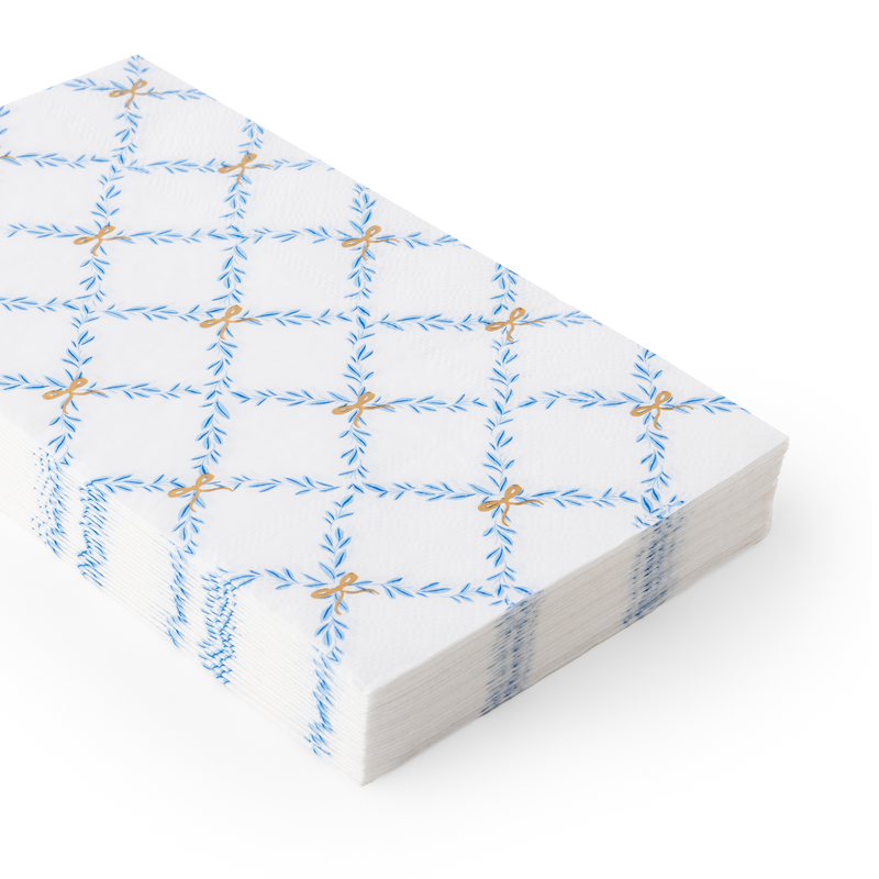 Stack of Sky Blue Trellis Guest Towels shown from side angle.