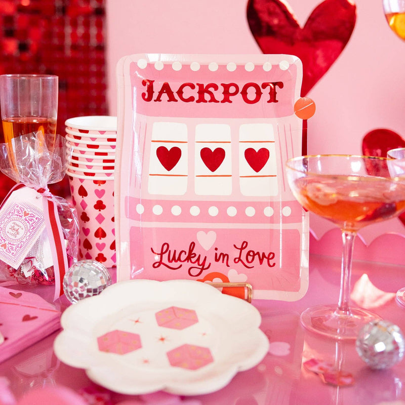 Slot machine plate styled on a pink Valentine party table.