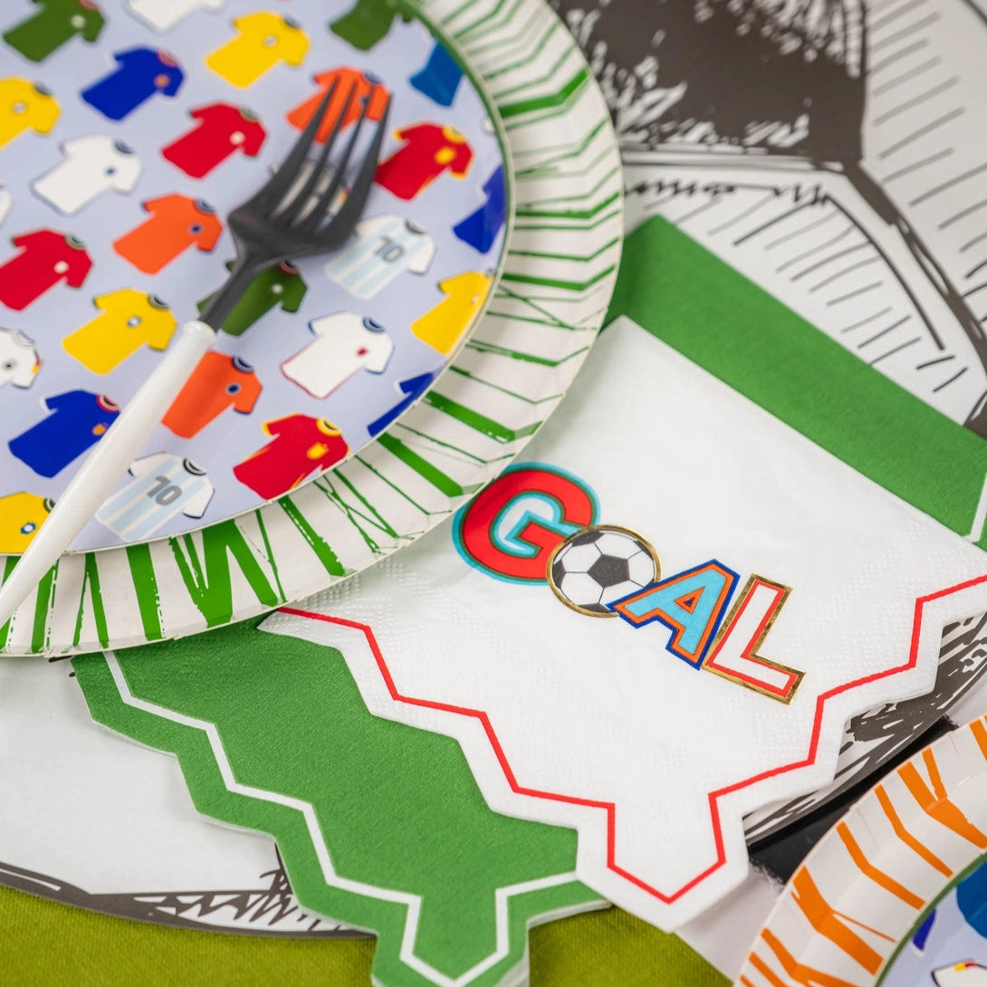 Green place setting with layered napkins and ball décor