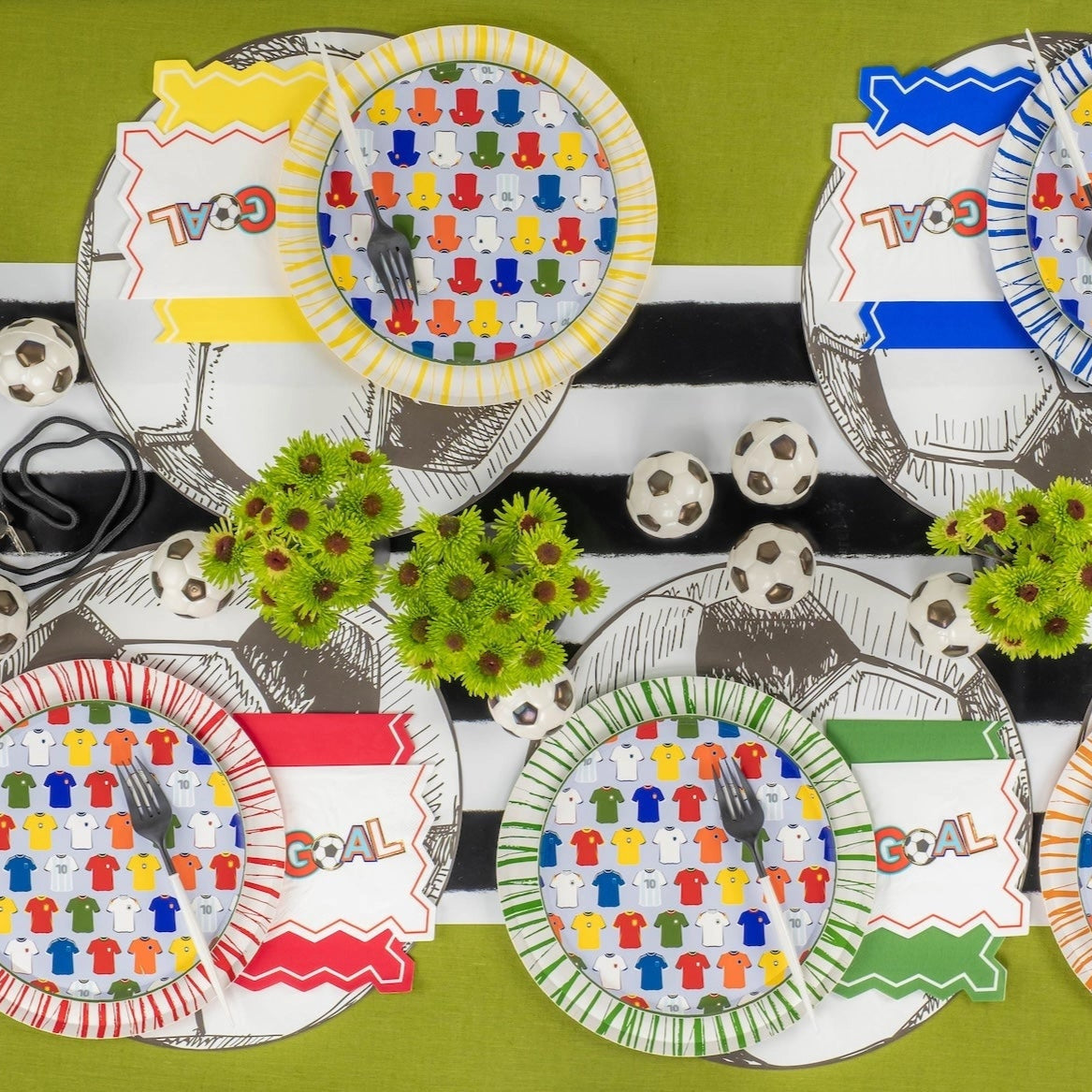 Overhead spread of four colorways with GOAL napkins