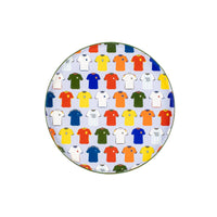 Flat lay of five plates with napkins and ref’s whistle