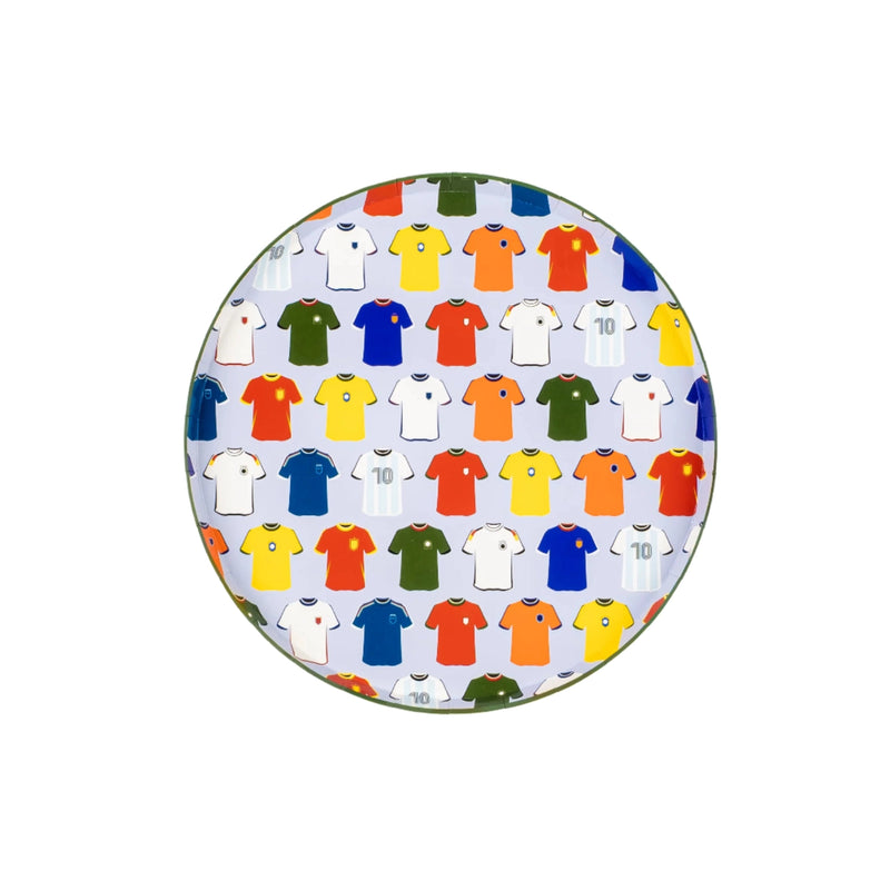 Flat lay of five plates with napkins and ref’s whistle