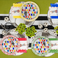 Overhead spread of four colorways and whistle props