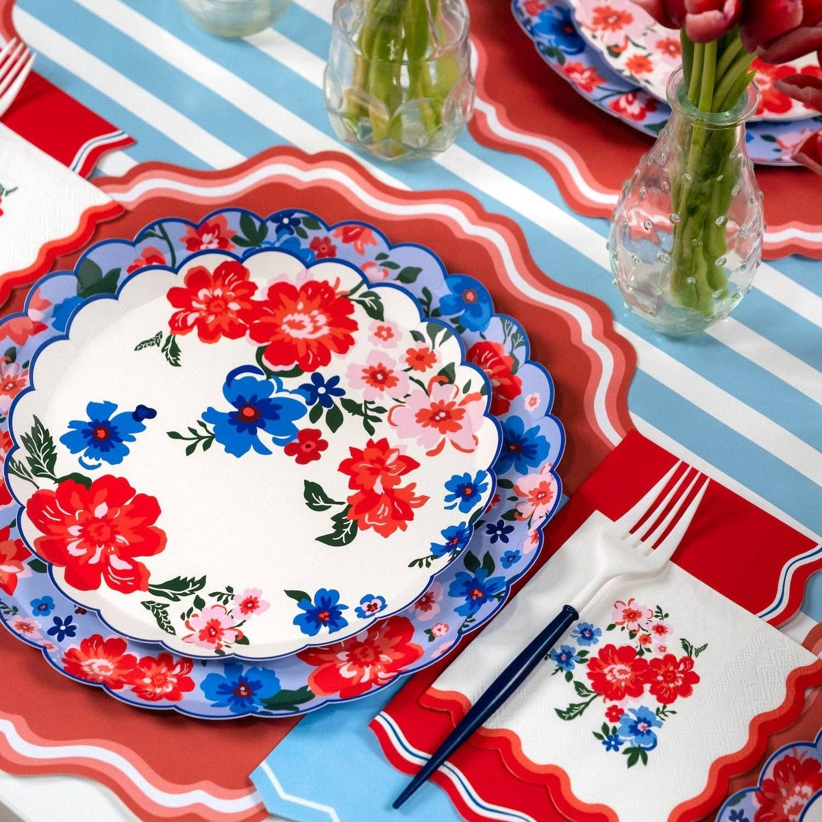 Large Summer Dinner Plates styled on a blue and white striped runner with fresh red tulips.