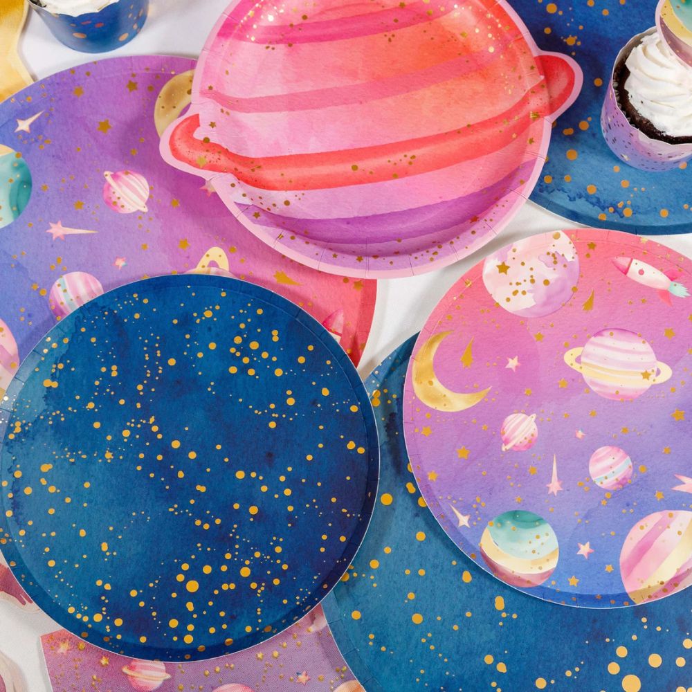 space party table with galaxy plates and themed decor