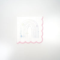 Product cutout: sparkle rainbow beverage napkin with holographic foil and scalloped pink edge.