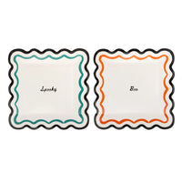 Two square Halloween paper plates with wavy black edges, one with a teal wavy border and Spooky in black script, one with an orange wavy border and Boo in black script