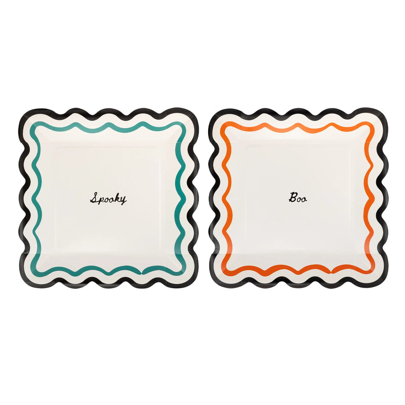 Two square Halloween paper plates with wavy black edges, one with a teal wavy border and Spooky in black script, one with an orange wavy border and Boo in black script