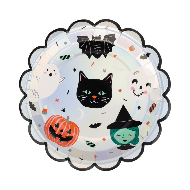 Top-down view of a 9 inch round paper plate featuring vintage Halloween characters and a silver foil scalloped edge on a pastel background.