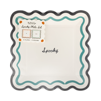 Spooky Halloween paper plate with teal wavy border and black scalloped edge shown in original 2-design packaging.