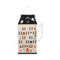 Spooky House Halloween countdown calendar in black and cream canvas with 31 numbered pockets and a felt ghost marker on a black ribbon