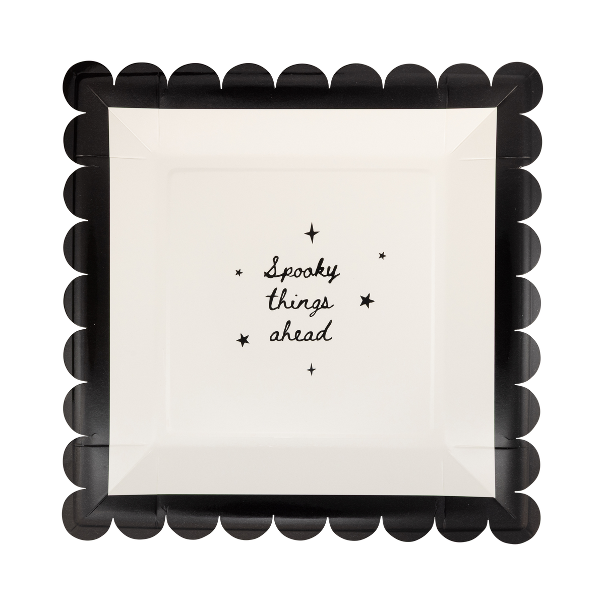 Cream scalloped paper plate with black "SPOOKY THINGS AHEAD" text and a black scalloped edge, front view.