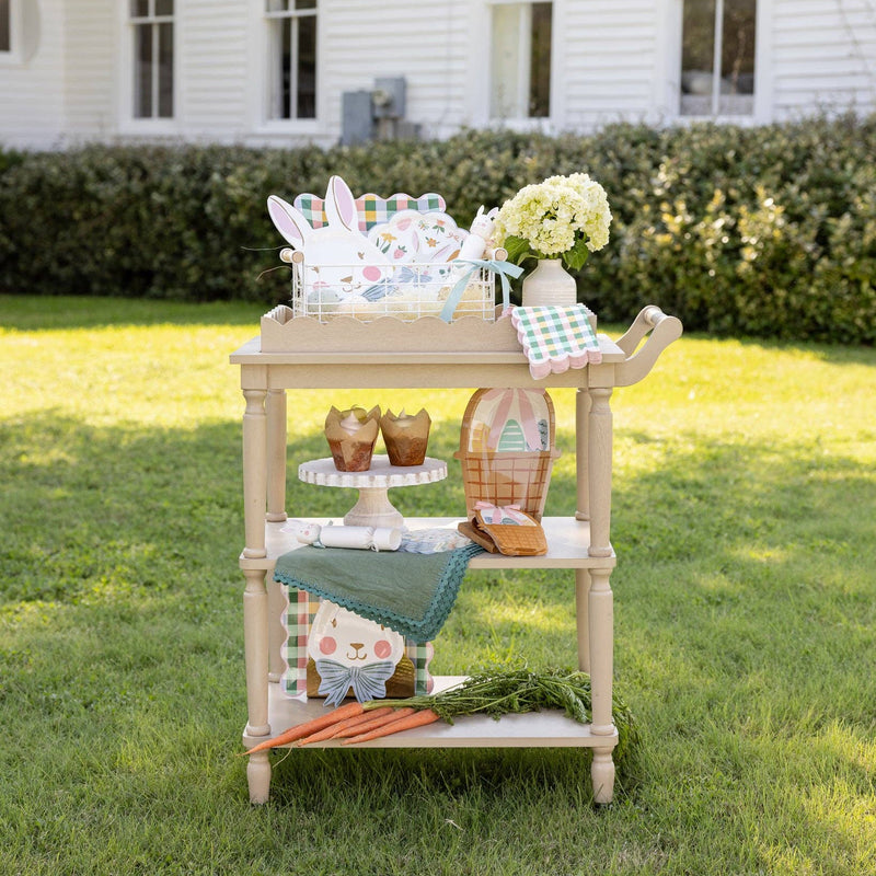 Spring party cart styled outdoors with gingham napkins and Easter table decor