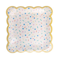 Sprinkles party plate showing colorful confetti pattern and scalloped gold trim detail in packaging.