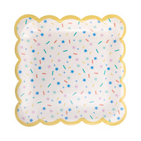 Scalloped square party plate with pastel sprinkles pattern and gold border.
