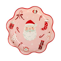 Pink scalloped plate with Santa and Christmas icons