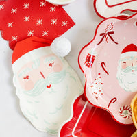Close-up of Santa napkin with red hat next to red star napkin