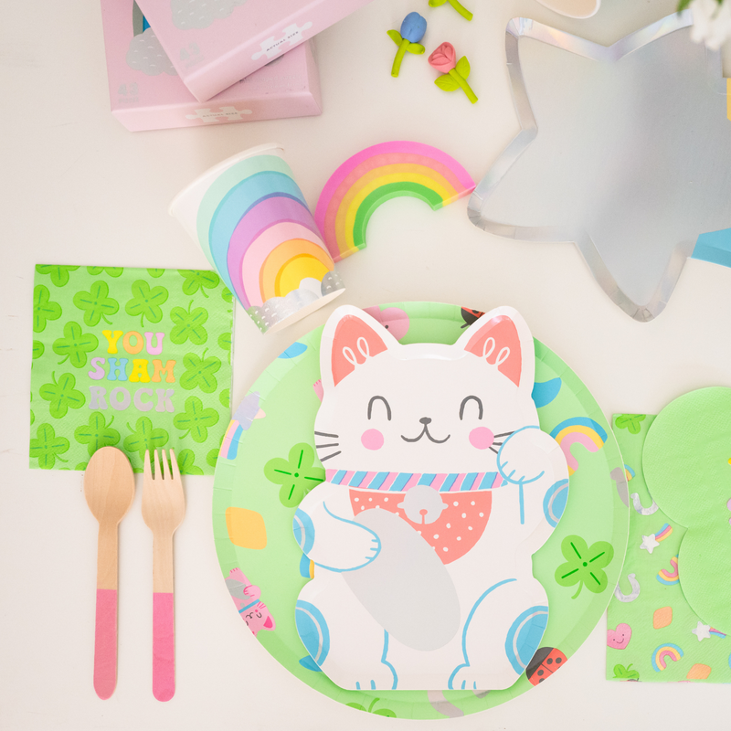 St. Patrick’s Day party table with Lucky Me You Sham Rock napkins and rainbow decor.