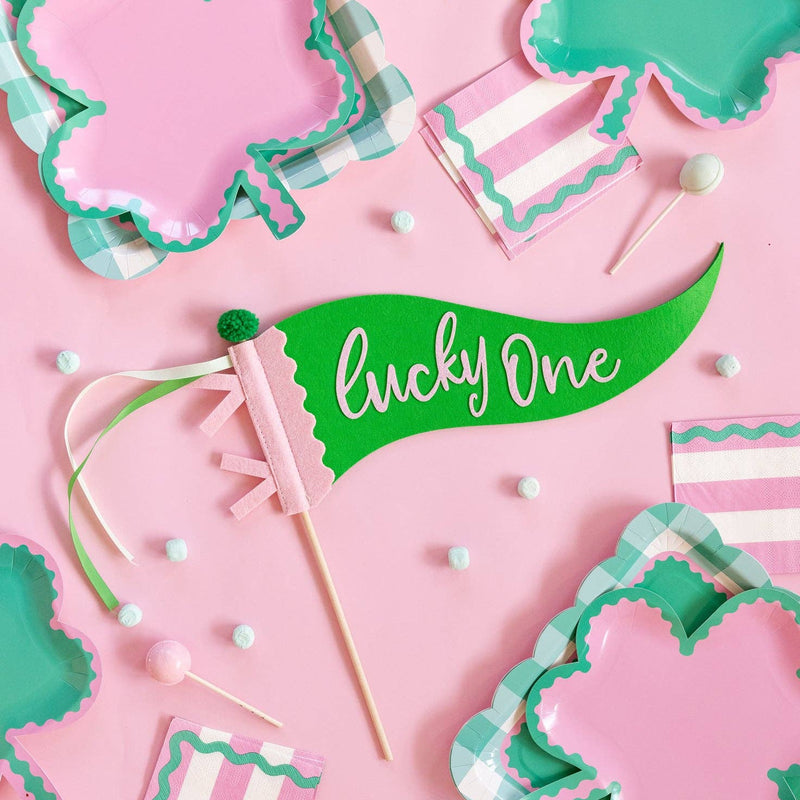 Pink and green St Patrick’s Day cocktail napkins styled on party table