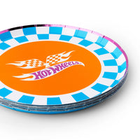Stacked set of hot wheels birthday party plates showing the round shape and pink foil rim.