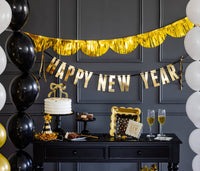 New Year’s Eve party table featuring Star Pattern Plate and gold décor
