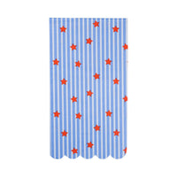 Single stars and stripes paper guest napkin laid flat showing blue and white vertical stripe pattern, scattered red stars, and scalloped bottom edge