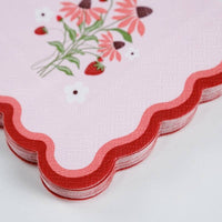 Tight macro shot of the 3-ply texture and red scalloped edge on the Strawberry Cocktail Napkins.