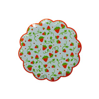 Single strawberry scalloped paper dessert plate on a white background showing the wavy red scalloped edge, pale blue base, and scattered red strawberries with green vines, tiny daisies, and gold star accents