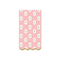 Pink striped floral paper dinner napkin with scalloped gold edge on white background