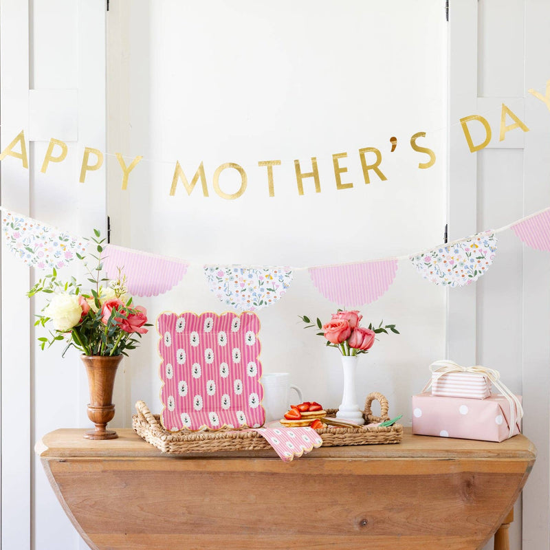 Striped floral pink plates styled on a Mother's Day brunch party setting