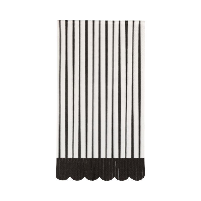 Black-and-cream striped paper dinner napkin with a black scalloped edge, front view.