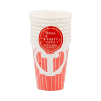 Stack of 8-pack 12oz red paper cups with handles in the original plastic packaging.	