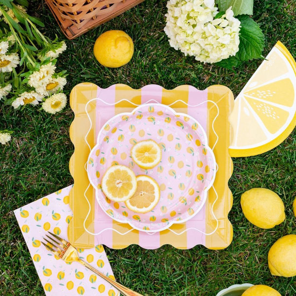 Lemon themed setup with striped square plate and citrus decor