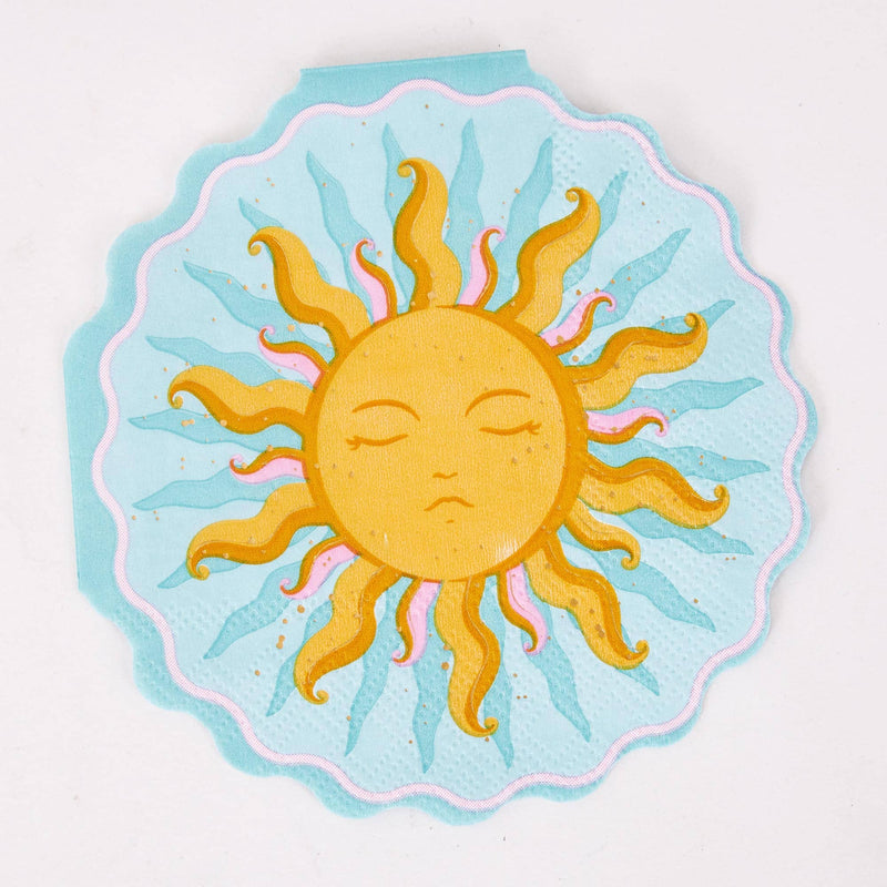 Single sun shaped paper cocktail napkin with a gold celestial sun face, sky blue background, and scalloped foil edge.
