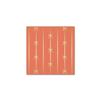 Close-up of Sunkissed Orange bow napkins showing gold foil detailing