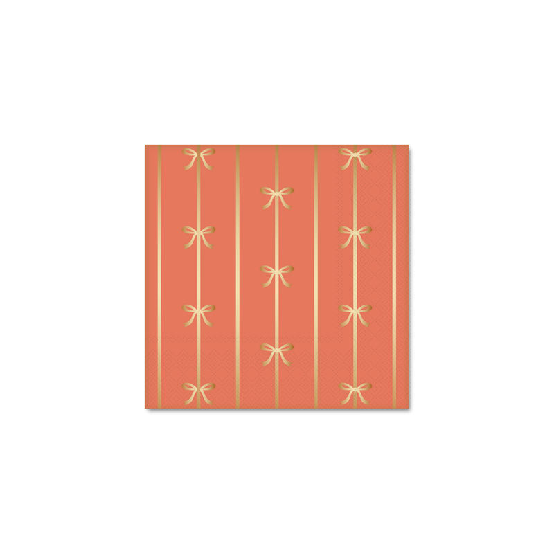 Close-up of Sunkissed Orange bow napkins showing gold foil detailing