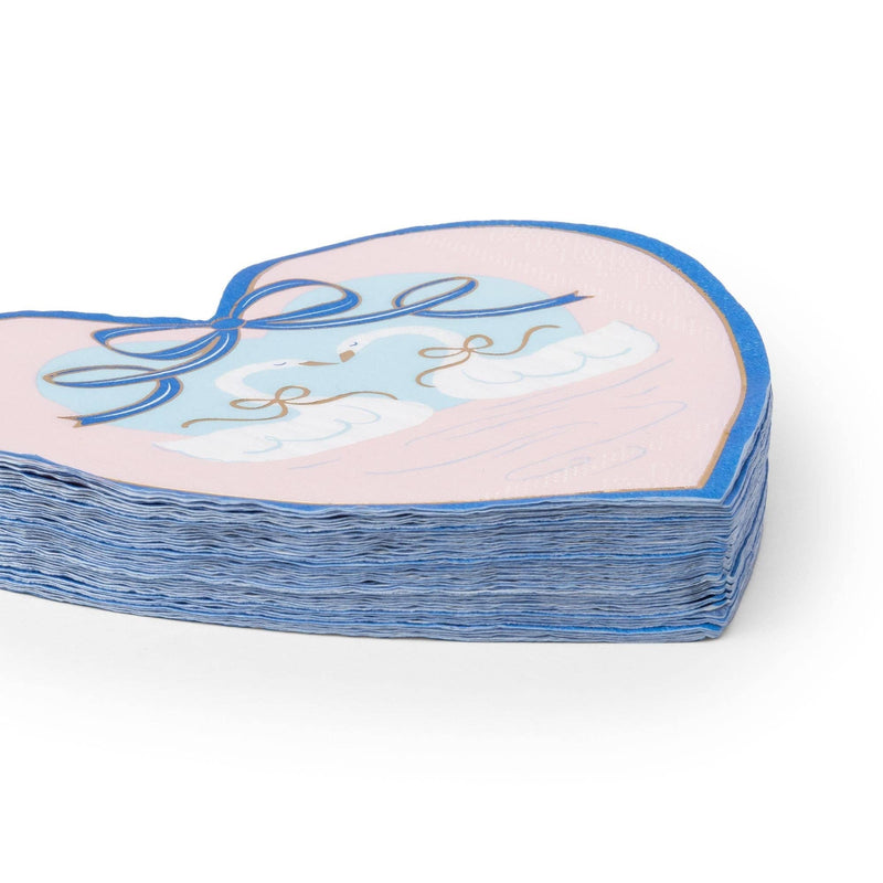 Stack of 20 swan heart shaped paper napkins angled to show the die-cut heart edge and pack thickness