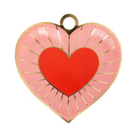 Pink heart-shaped plate with red center and gold foil radiating lines.