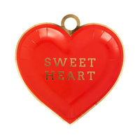 Red heart-shaped plate with “Sweet Heart” text and gold foil rim.