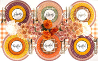 Symmetrical overhead view of a Thanksgiving dining table set with brown basketweave chargers, floral plates, and script napkins.