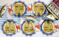 Fishing party tablescape with tan plaid base plates under vest shaped plates, fish napkins, bobber napkins, and striped cups.