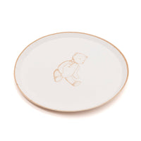 Tan teddy bear paper dessert plate at an angle on white, showing the 8.5 inch round shape
