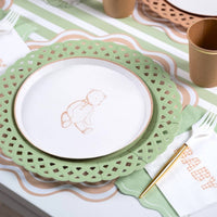 Tan teddy bear plate on a sage green lattice charger with a kraft gold rim cup
